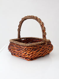vintage woven willow basket with wrapped arched handle