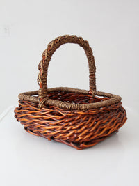 vintage woven willow basket with wrapped arched handle