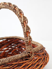 vintage woven willow basket with wrapped arched handle