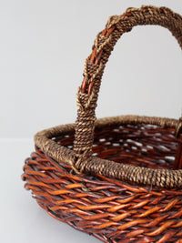 vintage woven willow basket with wrapped arched handle