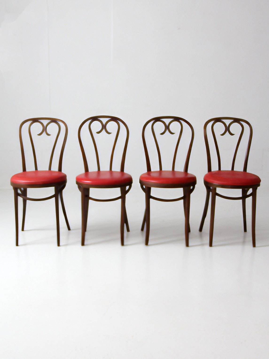 mid-century ZPM Radomsko bentwood dining chairs with red seats | set of four