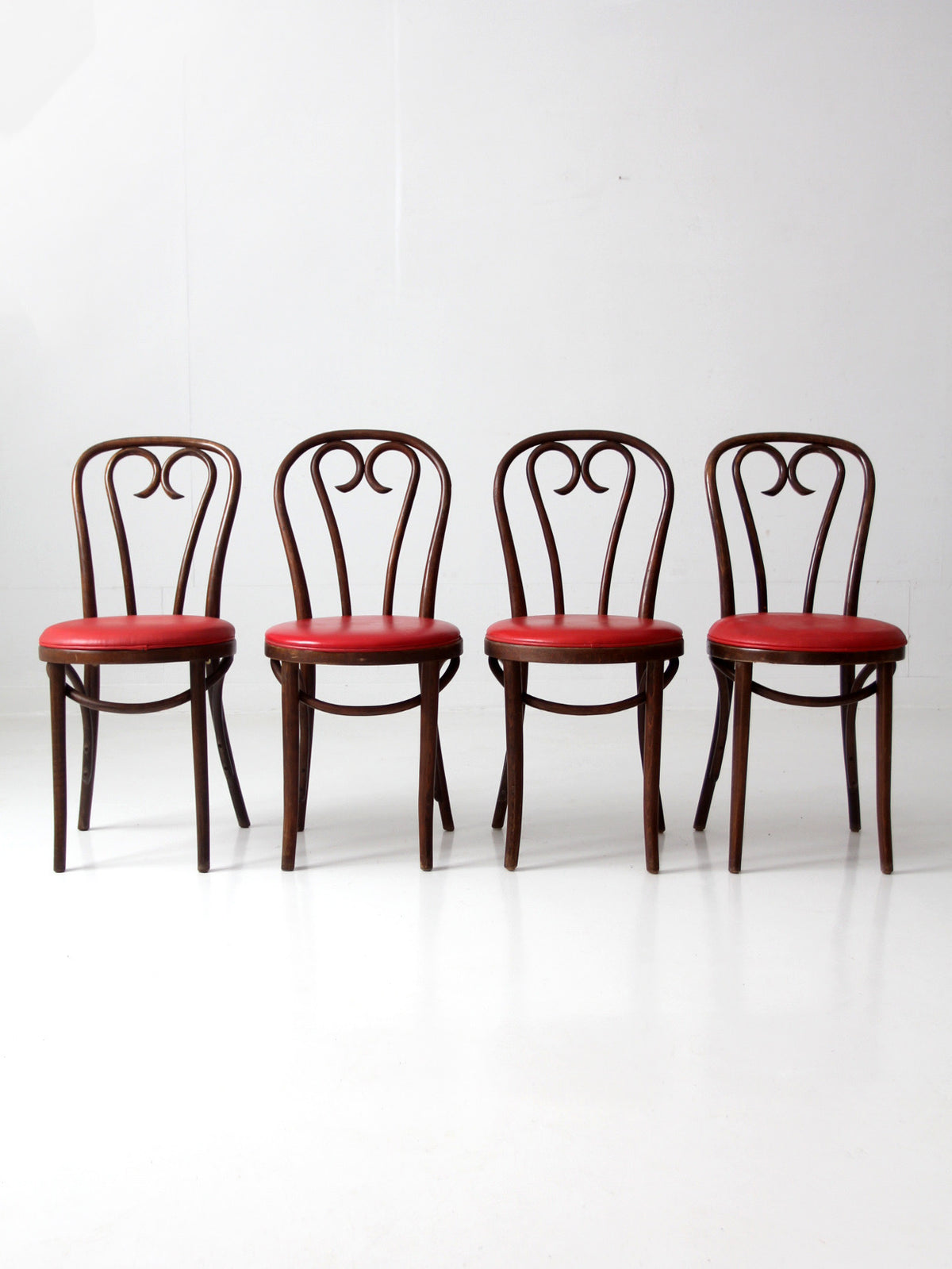 mid-century ZPM Radomsko bentwood dining chairs with red seats | set of four