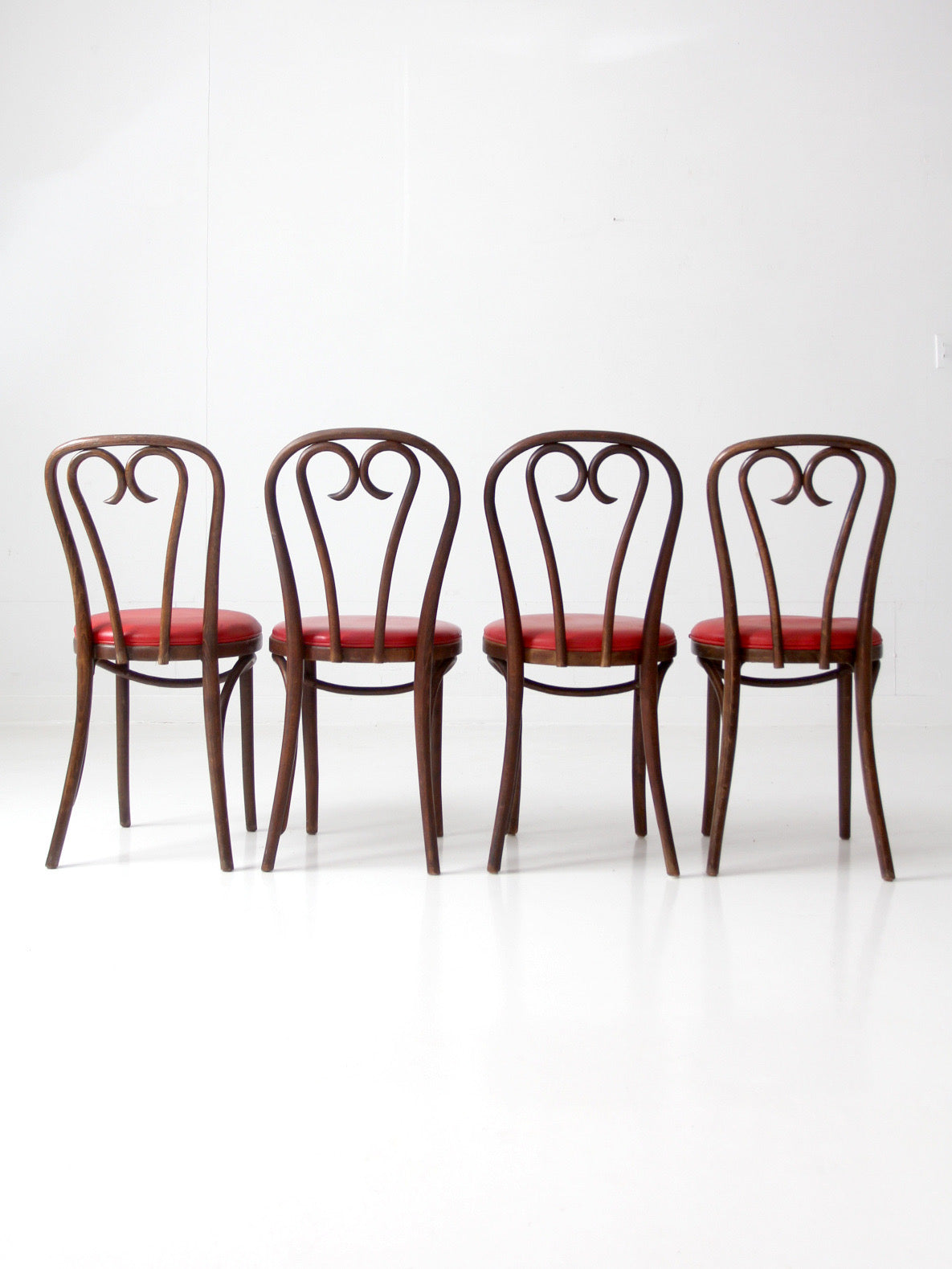 mid-century ZPM Radomsko bentwood dining chairs with red seats | set of four