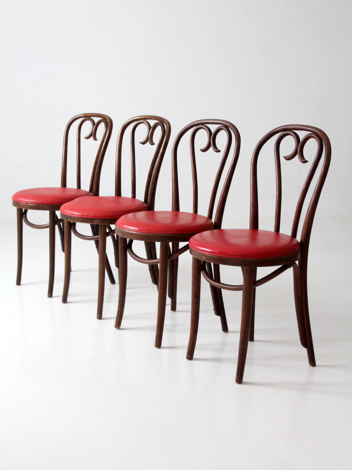 mid-century ZPM Radomsko bentwood dining chairs with red seats | set of four