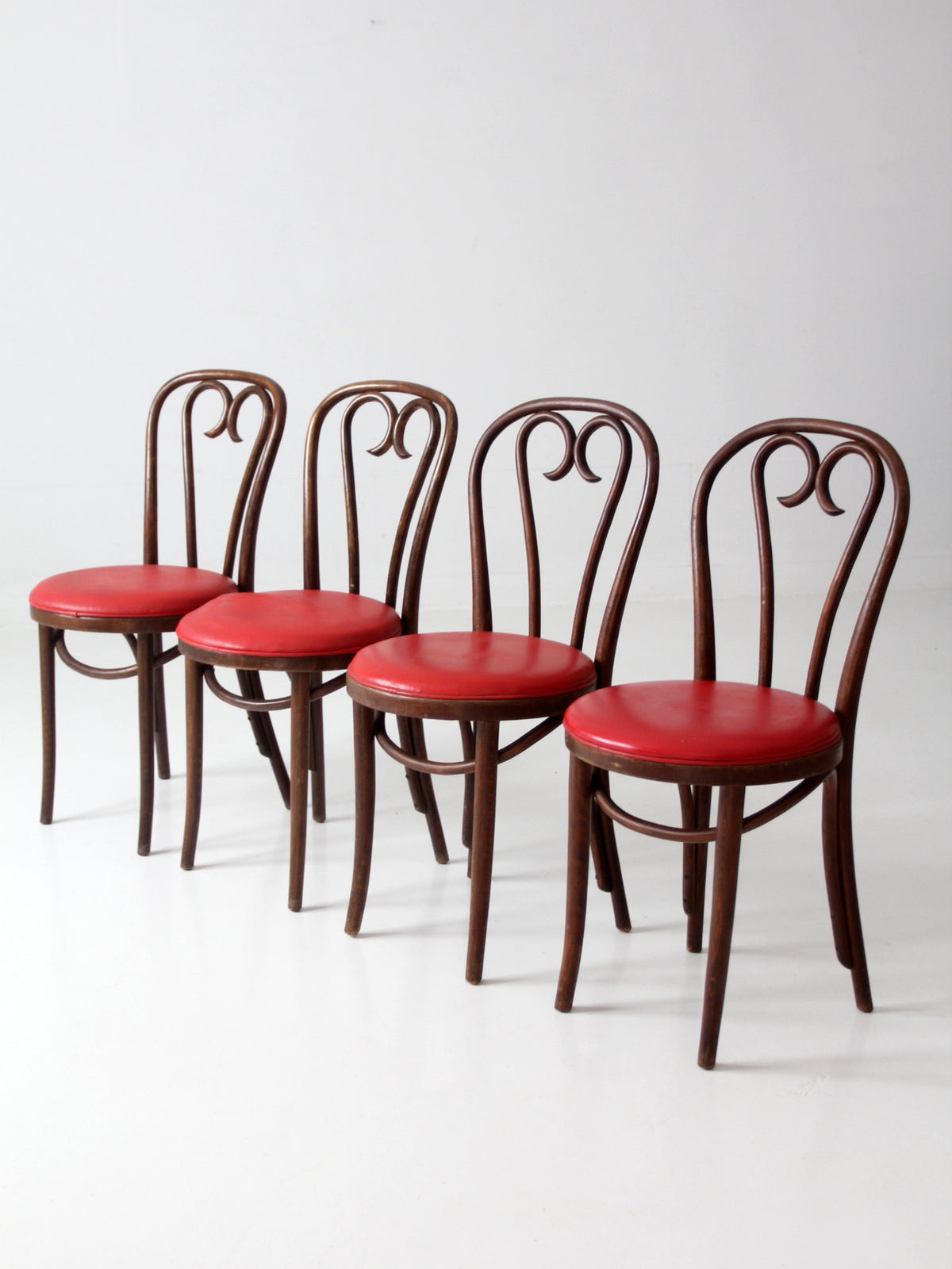 mid-century ZPM Radomsko bentwood dining chairs with red seats | set of four