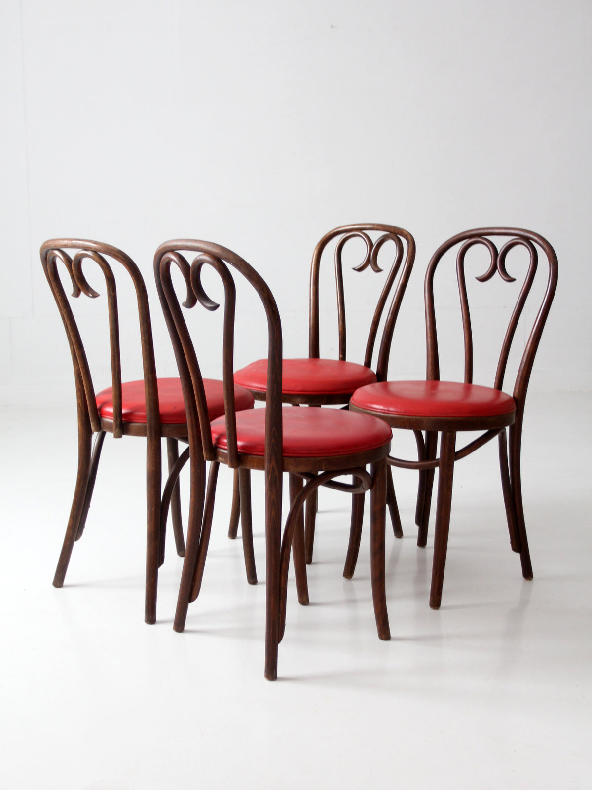 mid-century ZPM Radomsko bentwood dining chairs with red seats | set of four