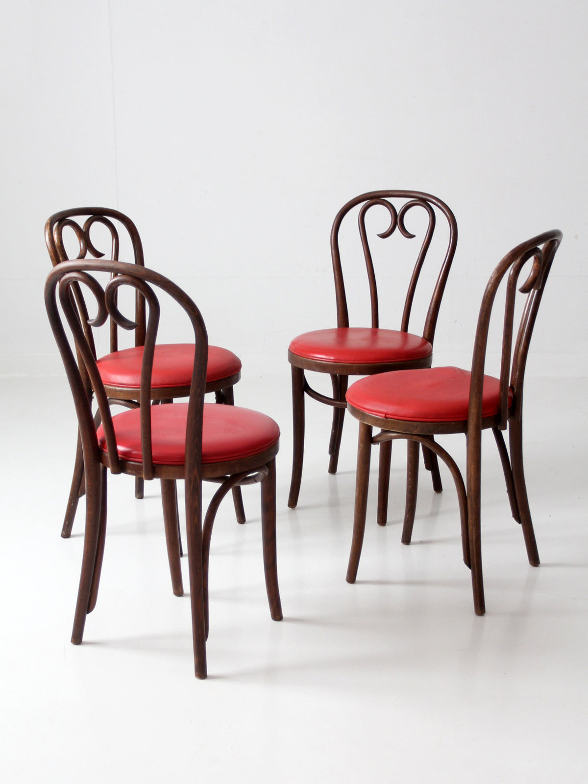 mid-century ZPM Radomsko bentwood dining chairs with red seats | set of four
