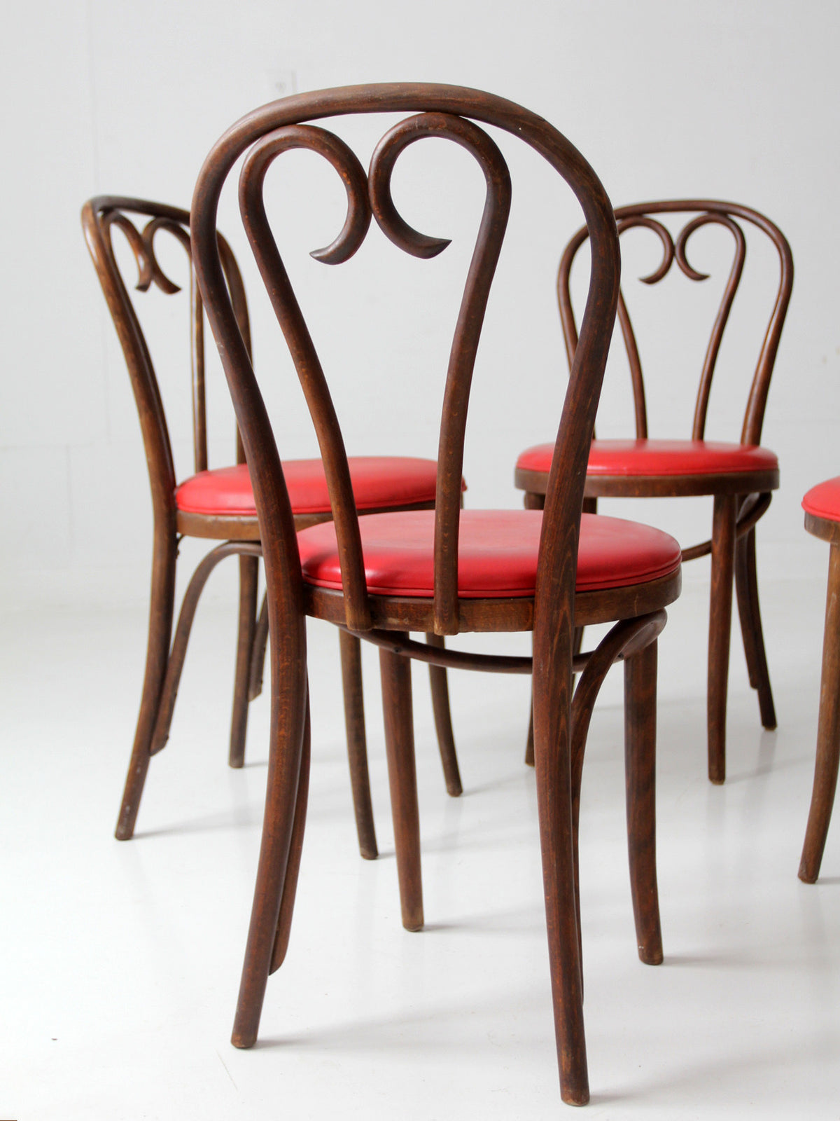mid-century ZPM Radomsko bentwood dining chairs with red seats | set of four