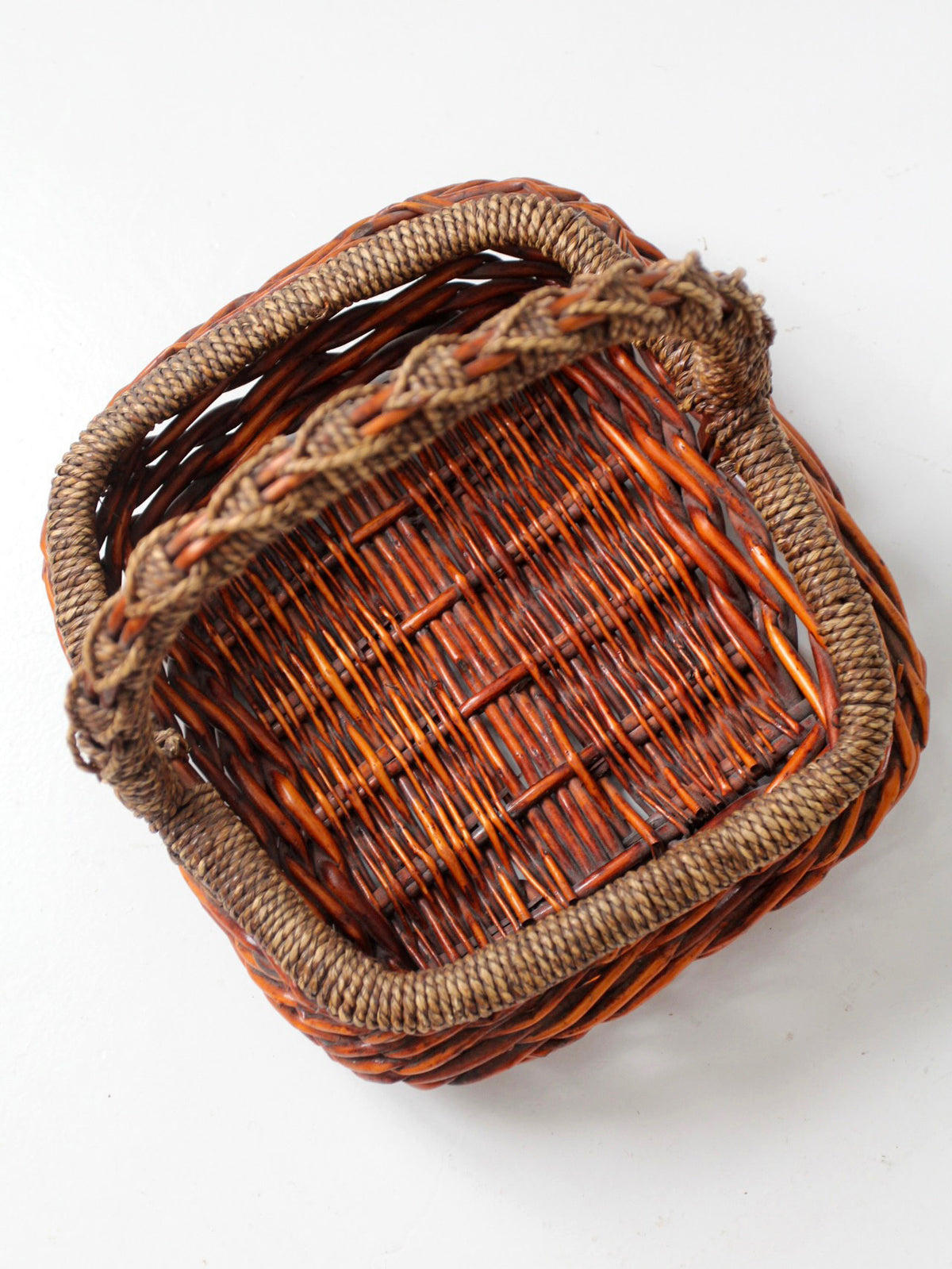 vintage woven willow basket with wrapped arched handle