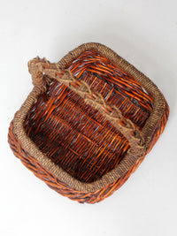 vintage woven willow basket with wrapped arched handle