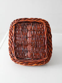 vintage woven willow basket with wrapped arched handle