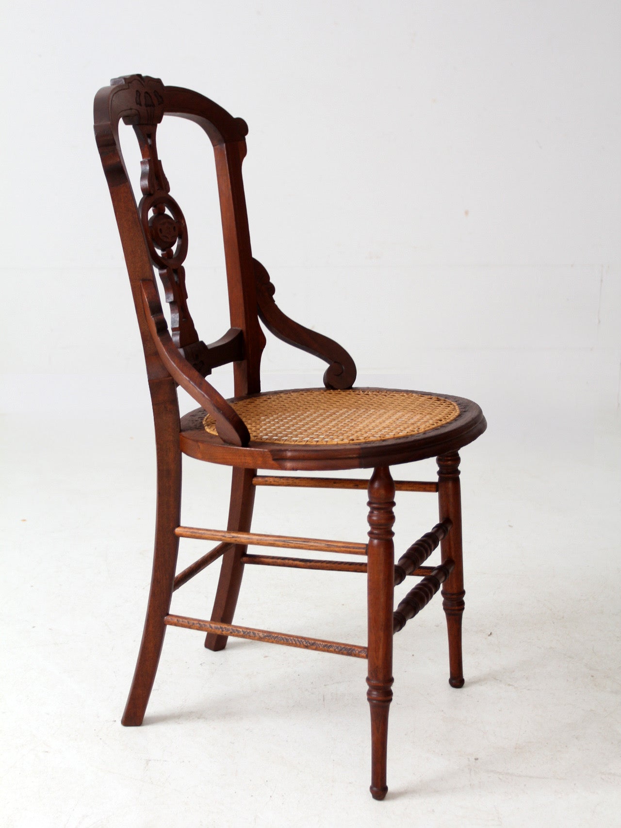 antique Victorian Eastlake chair with cane seat