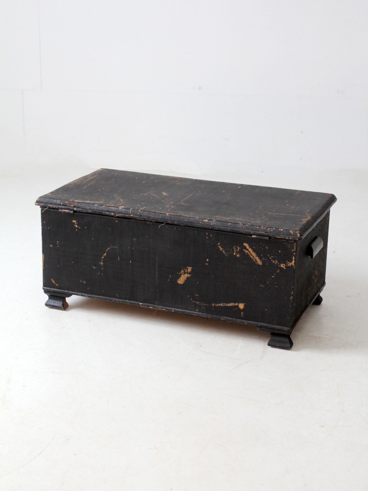 antique black woven canvas trunk