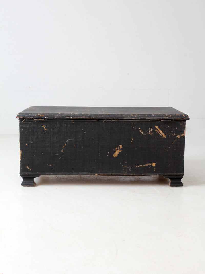 antique black woven canvas trunk