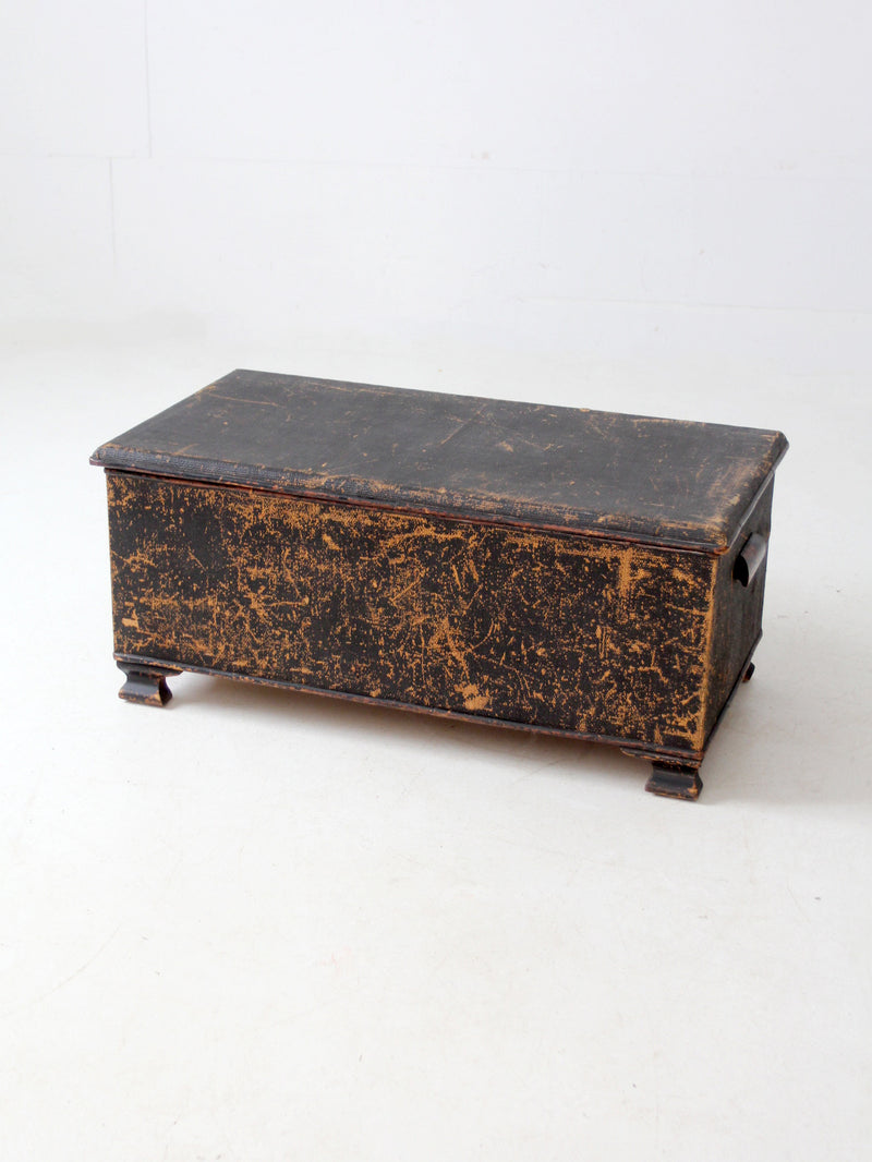 antique black woven canvas trunk