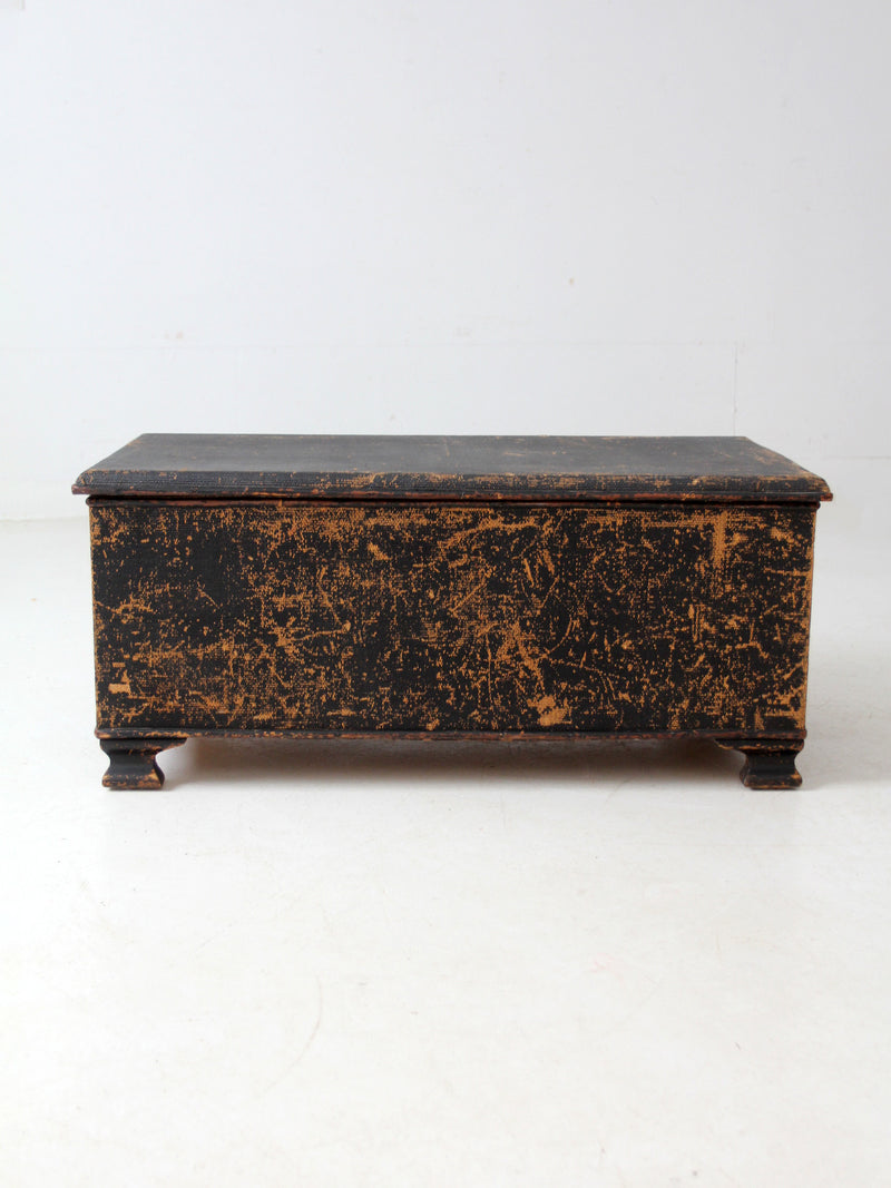 antique black woven canvas trunk