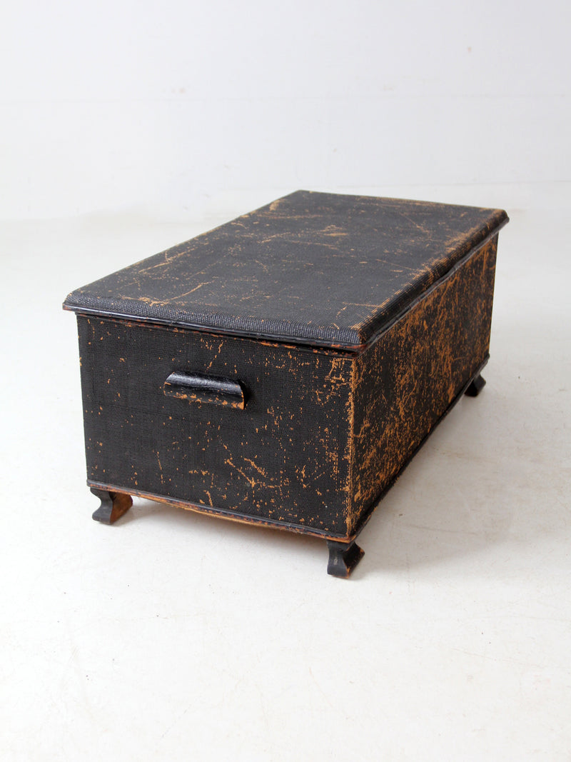 antique black woven canvas trunk