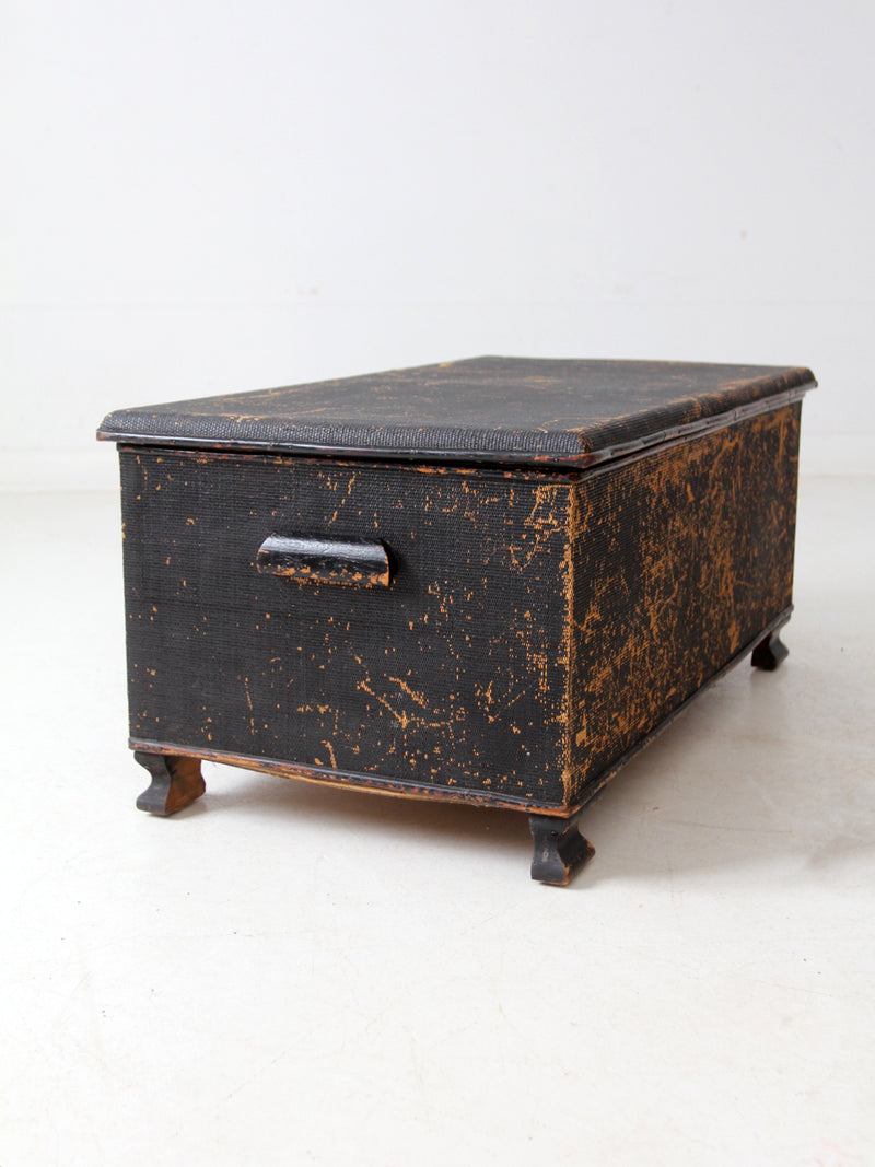 antique black woven canvas trunk