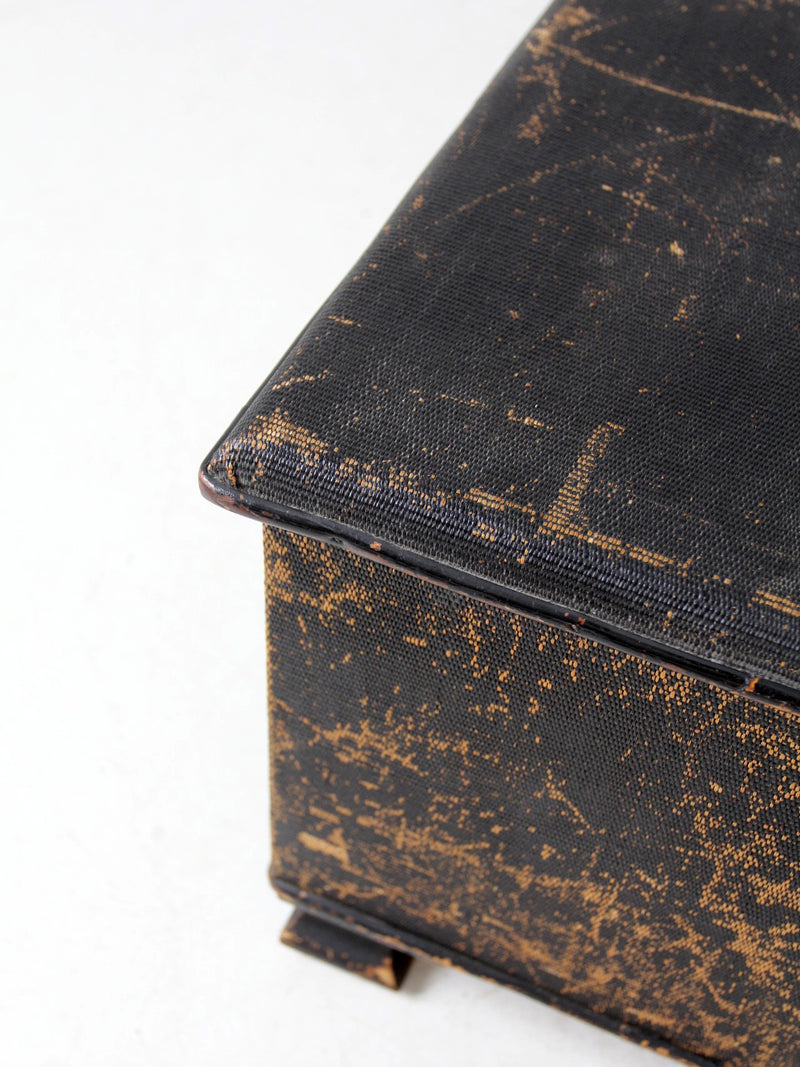 antique black woven canvas trunk