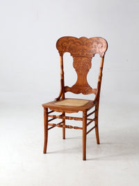 antique pressed back oak chair with cane seat