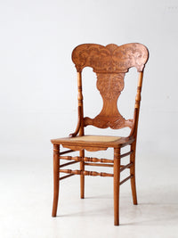 antique pressed back oak chair with cane seat