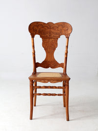 antique pressed back oak chair with cane seat
