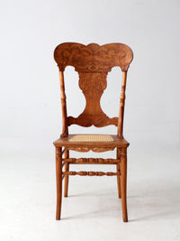 antique pressed back oak chair with cane seat