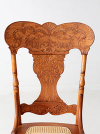 antique pressed back oak chair with cane seat