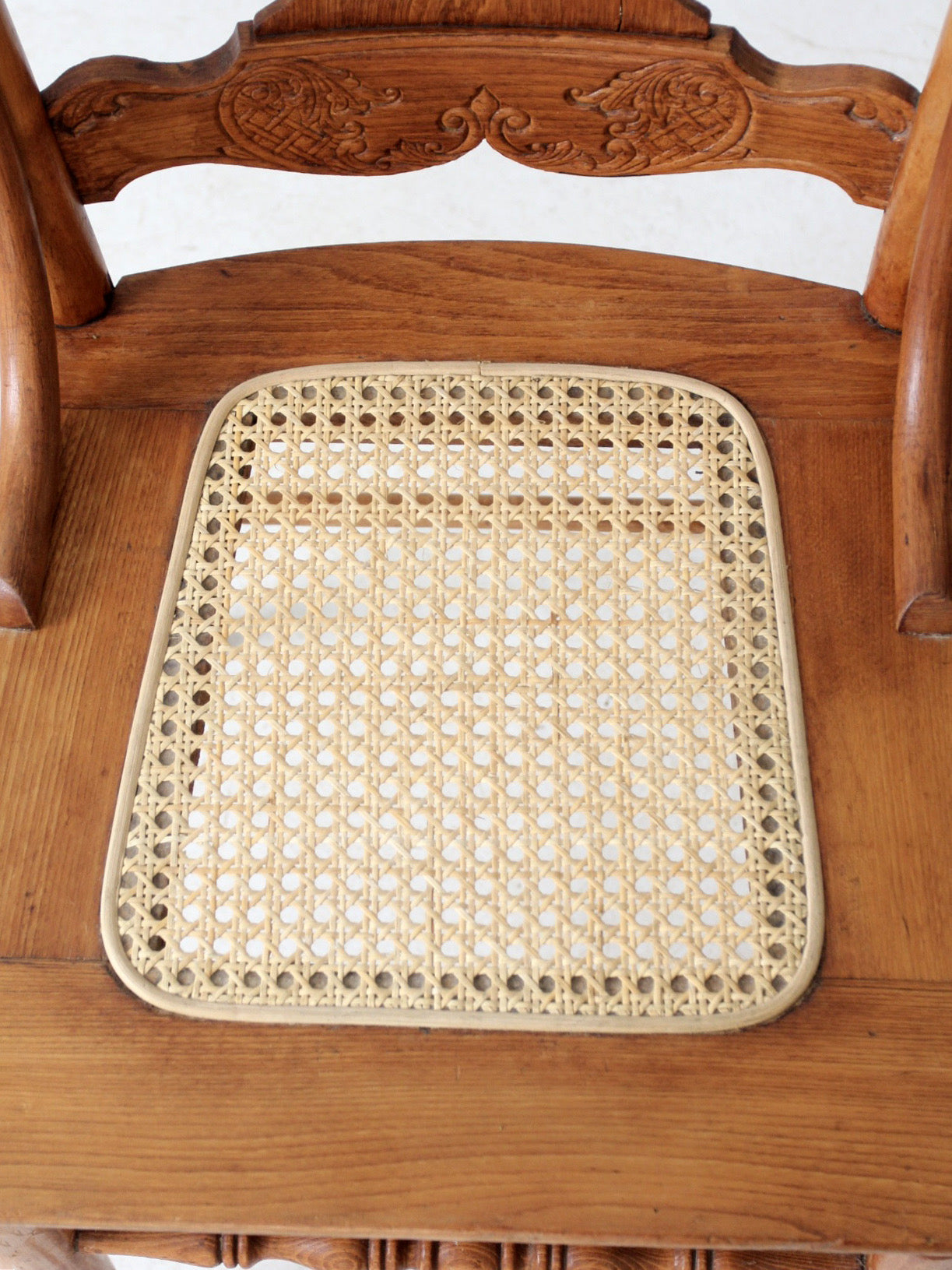 antique pressed back oak chair with cane seat