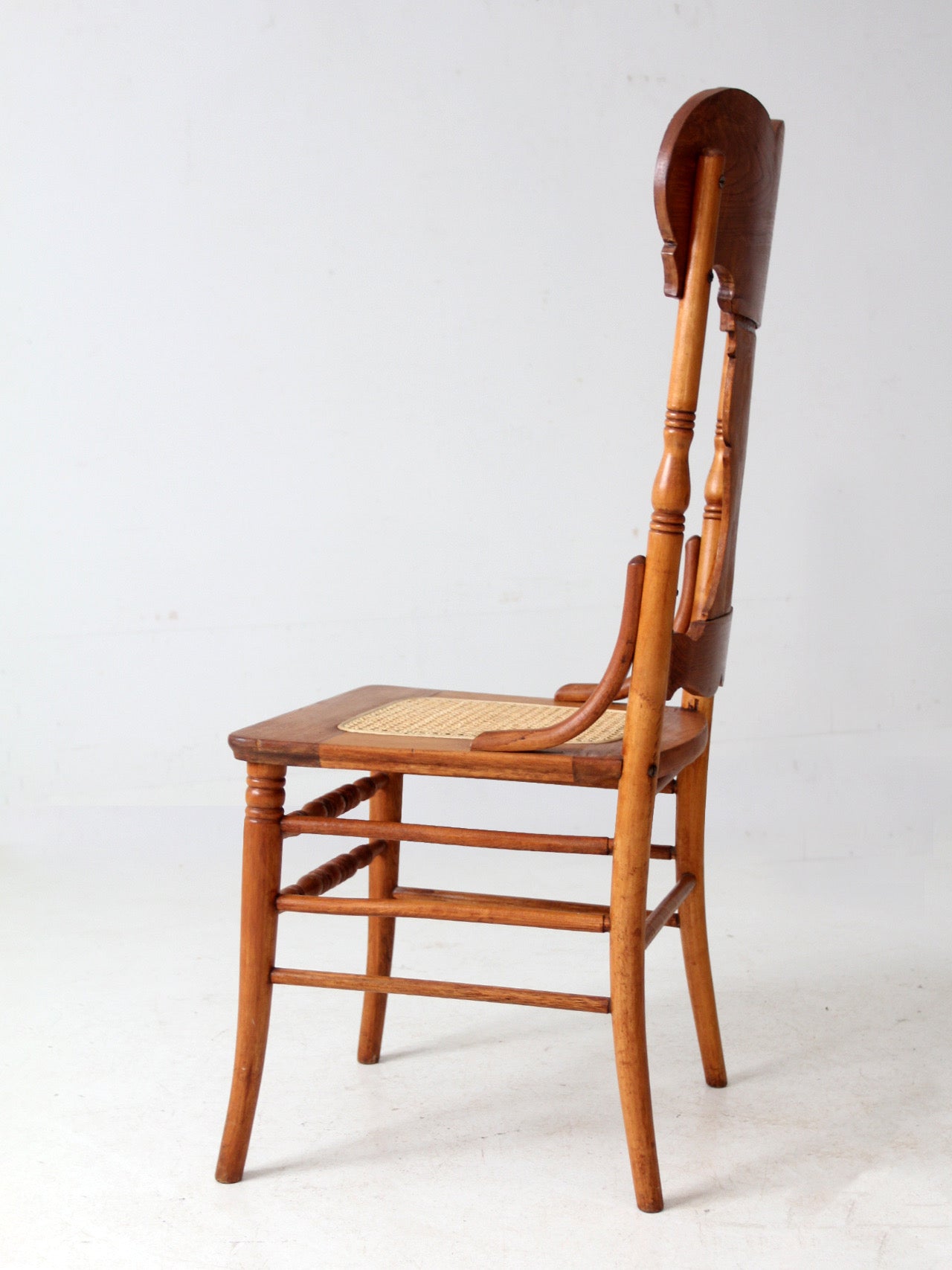 antique pressed back oak chair with cane seat