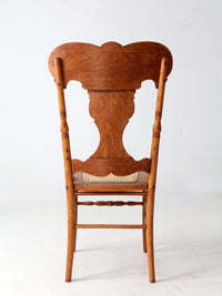 antique pressed back oak chair with cane seat