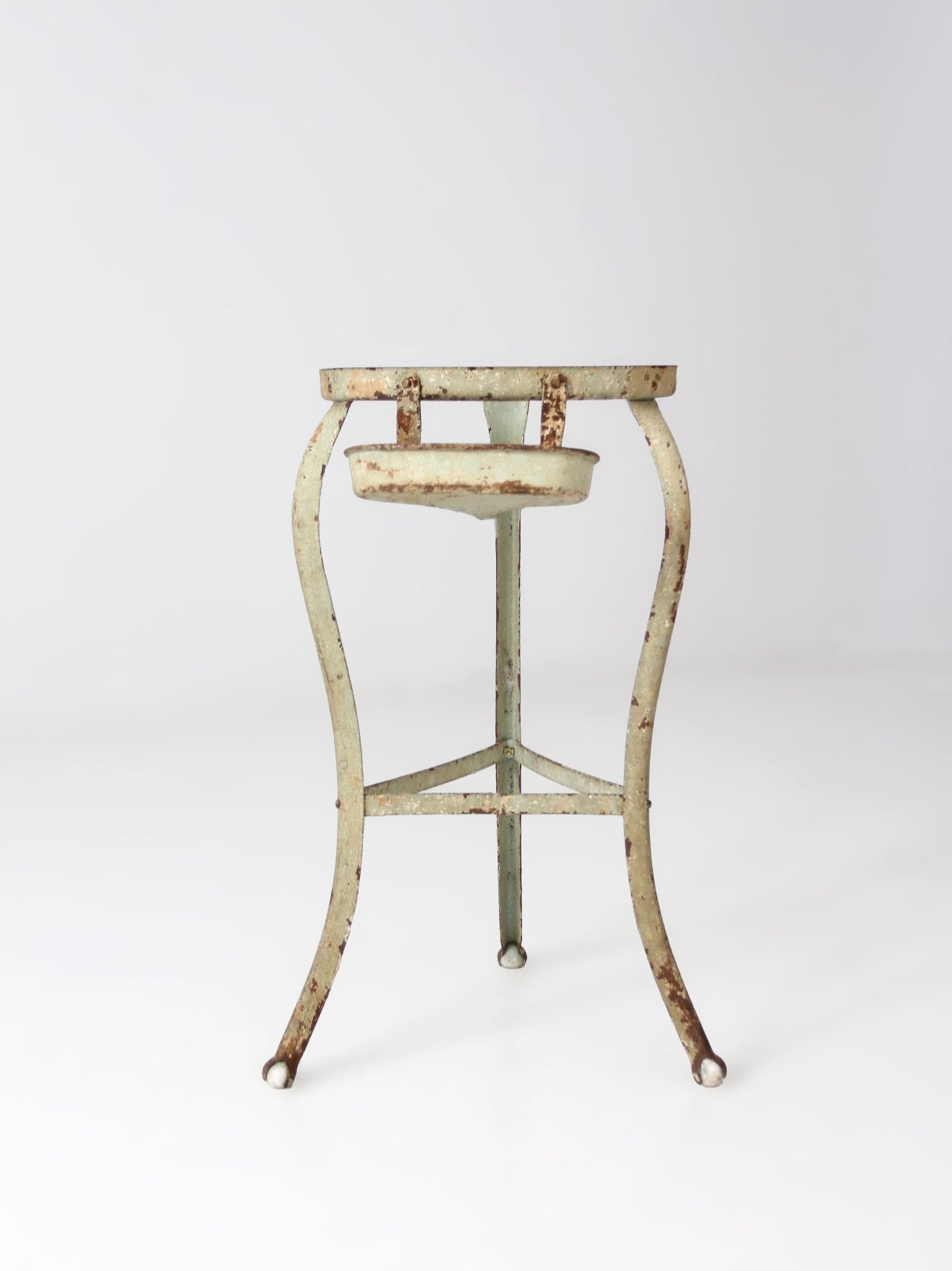 antique iron stand with ball feet