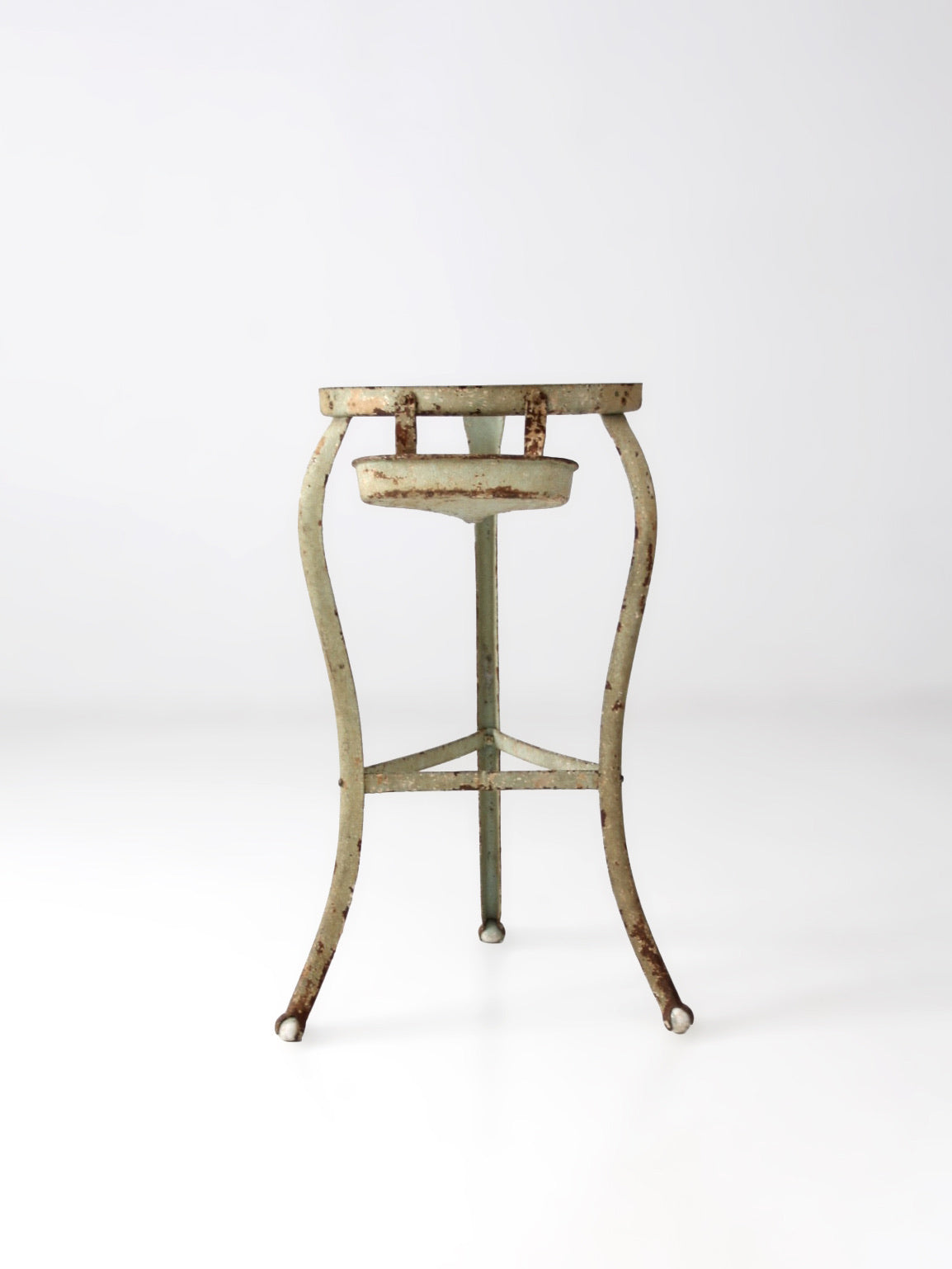 antique iron stand with ball feet