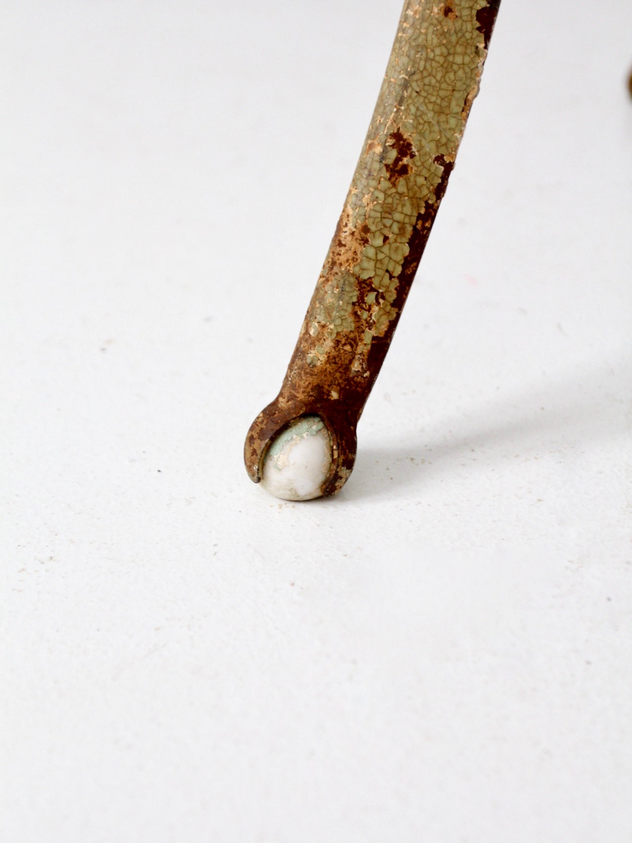 antique iron stand with ball feet