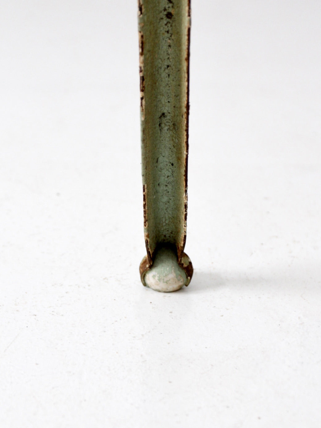 antique iron stand with ball feet