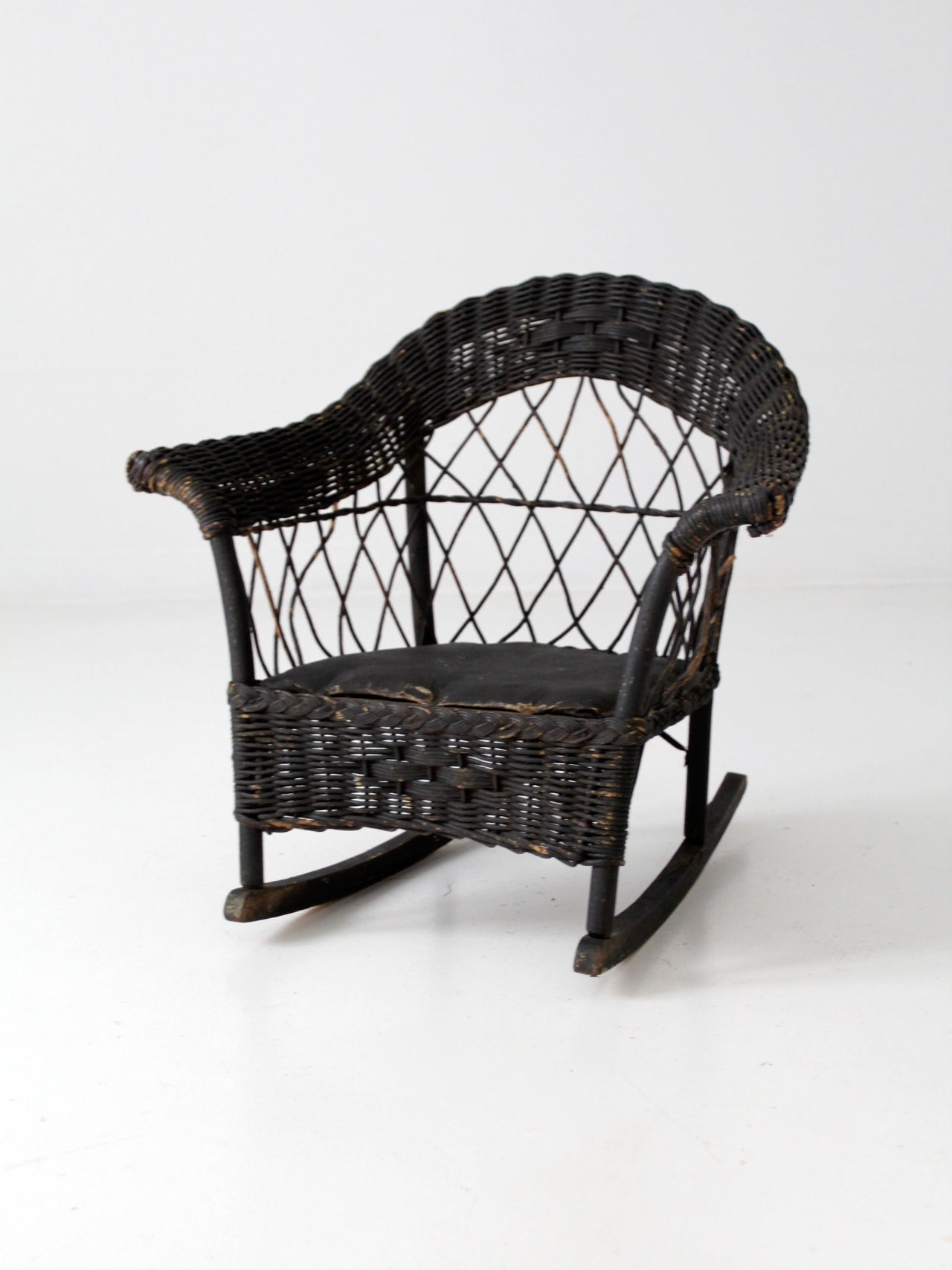antique Victorian black wicker child's rocking chair