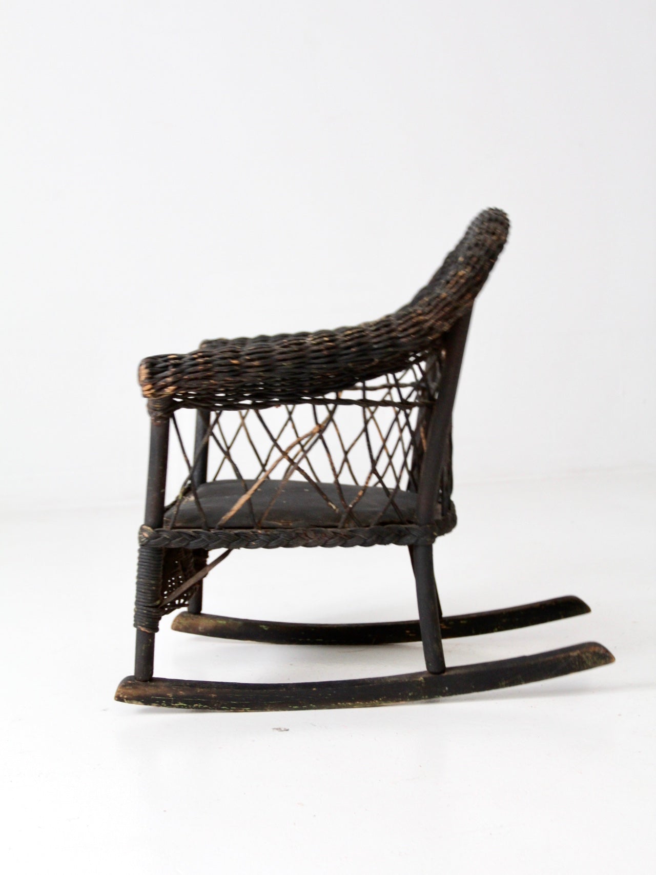 antique Victorian black wicker child's rocking chair