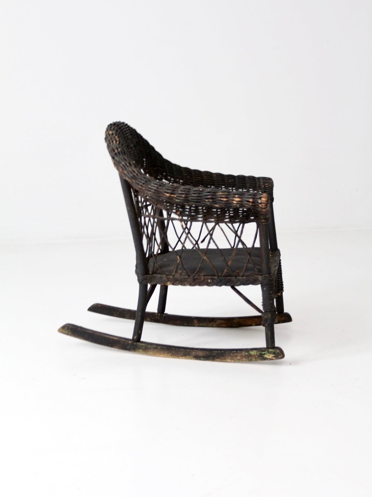 antique Victorian black wicker child's rocking chair