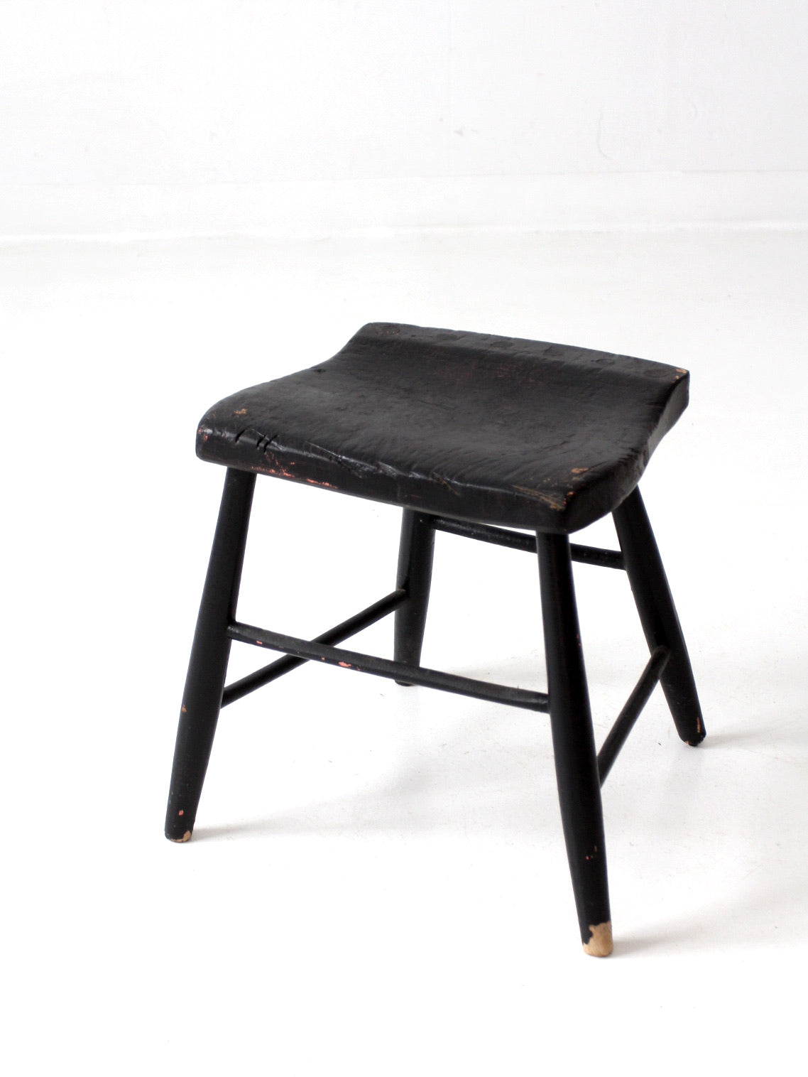 antique black wooden stool