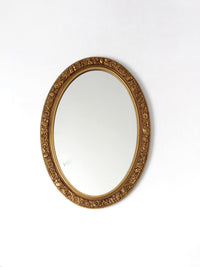 mid-century oval gilt wall mirror