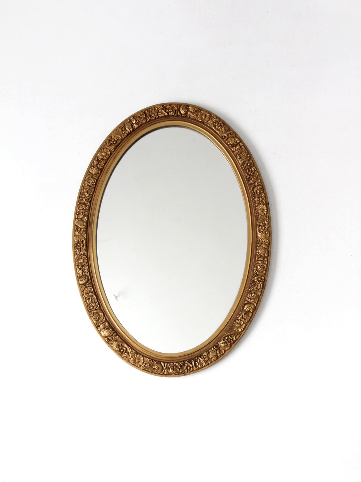 mid-century oval gilt wall mirror
