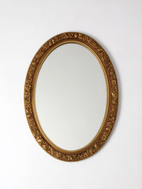 mid-century oval gilt wall mirror