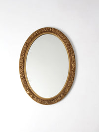 mid-century oval gilt wall mirror