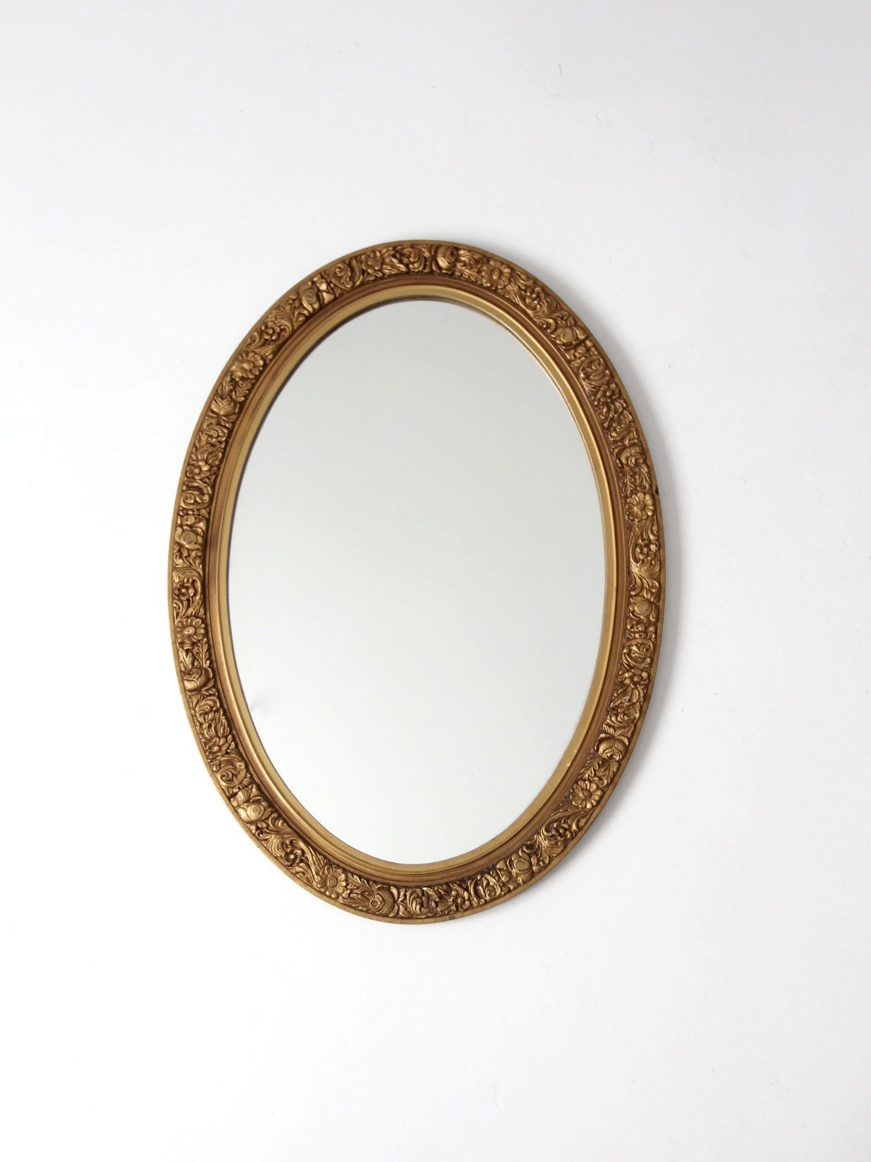 mid-century oval gilt wall mirror