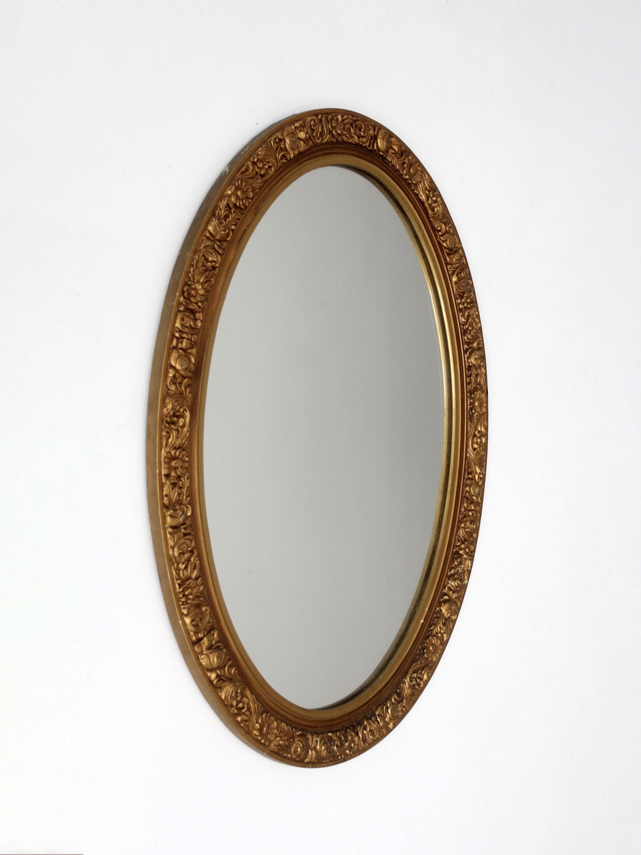 mid-century oval gilt wall mirror