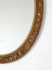 mid-century oval gilt wall mirror