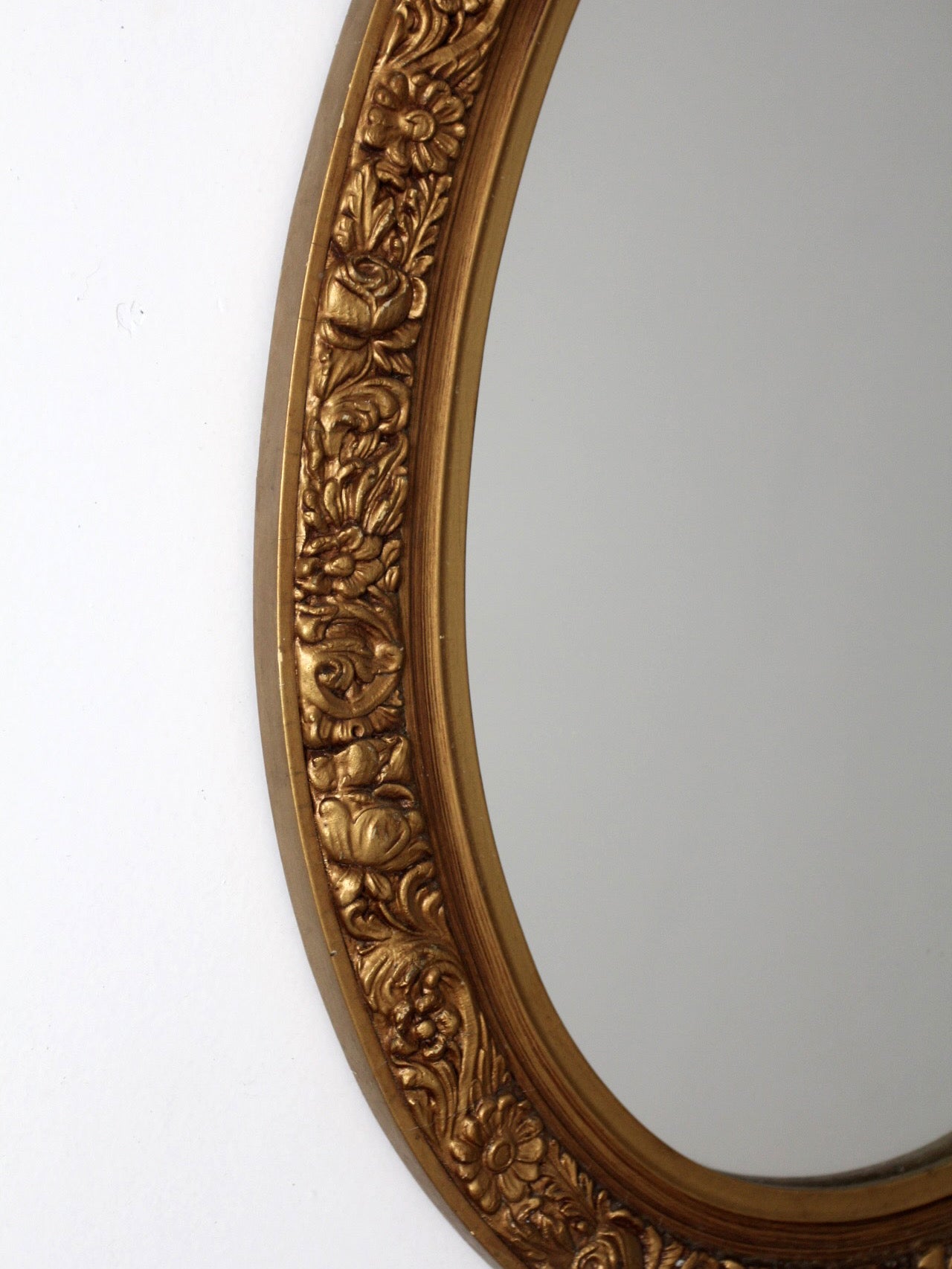 mid-century oval gilt wall mirror