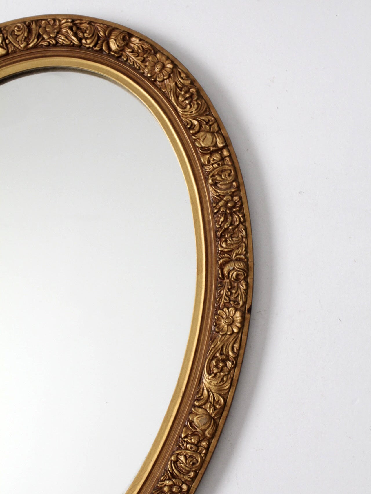 mid-century oval gilt wall mirror