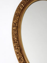 mid-century oval gilt wall mirror