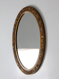 mid-century oval gilt wall mirror